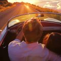 happy couple drivig a country&nbsp;road